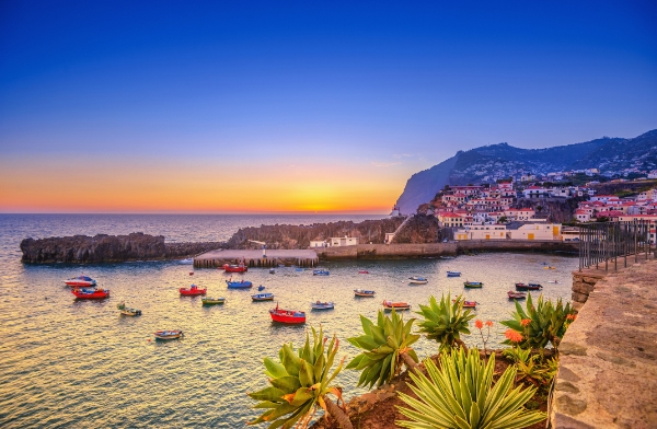 Boats on water at sunset in Madeira