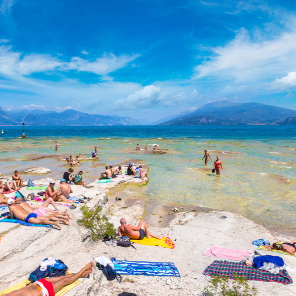 people swimming at sirmione beach