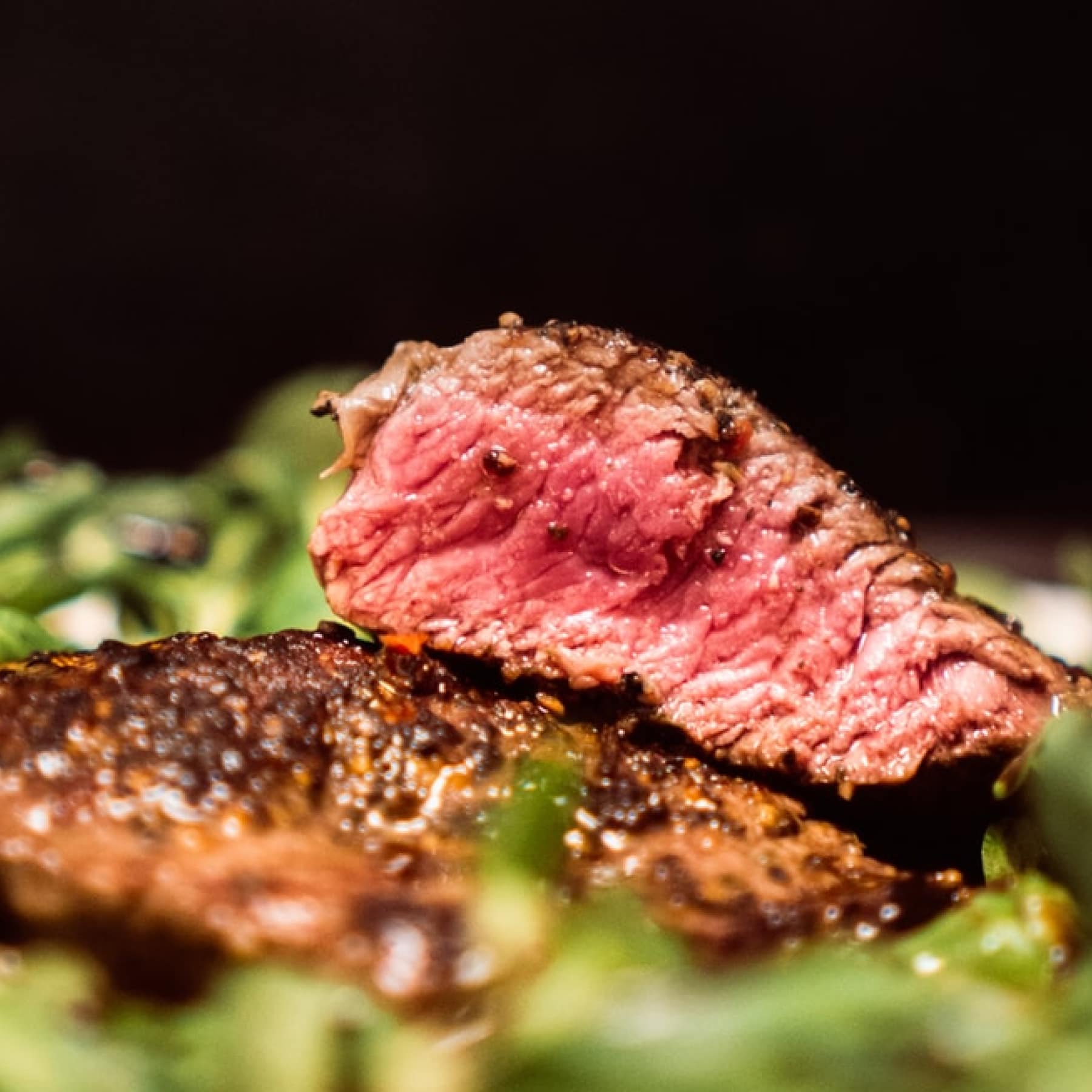 Fillet steak sat on top of vegetables