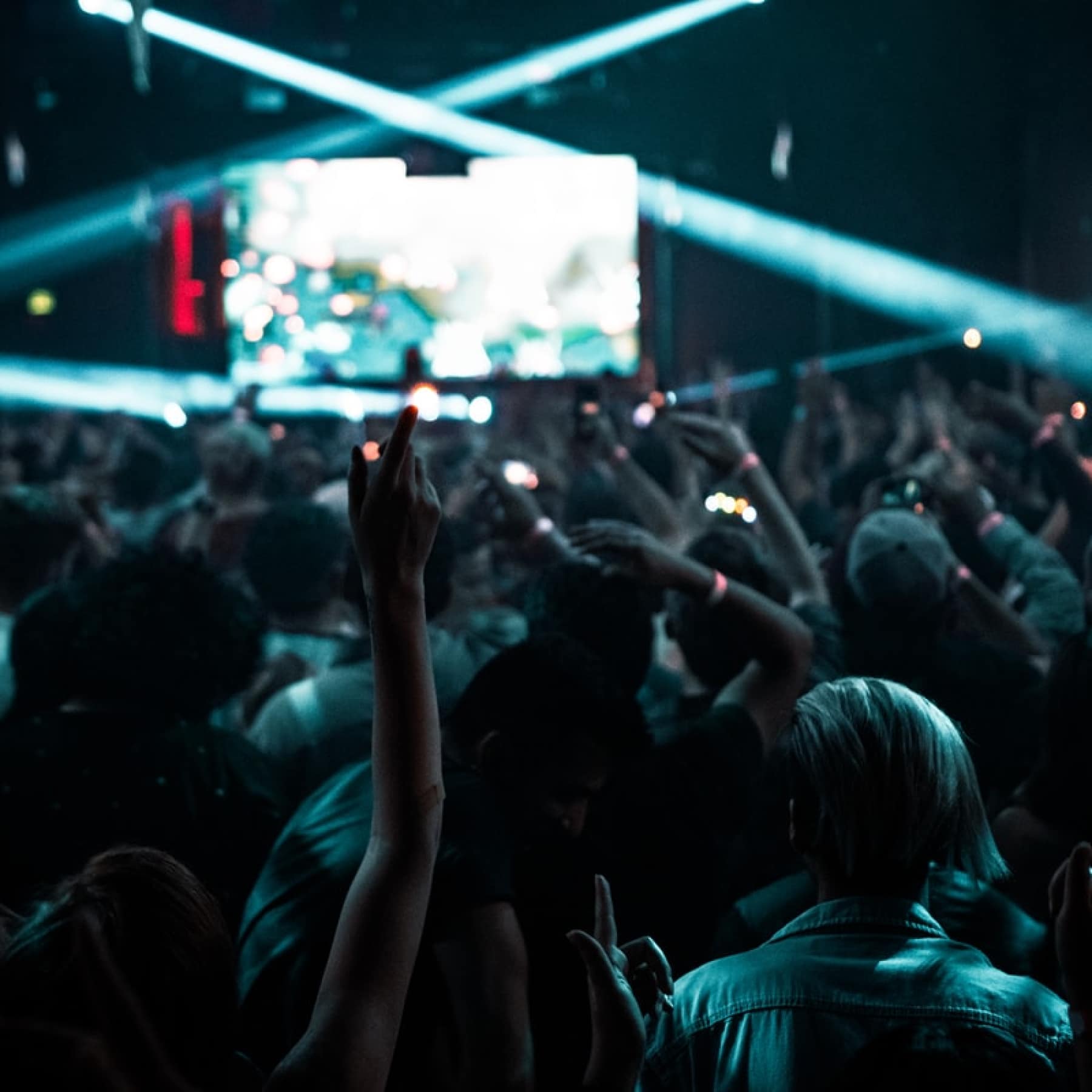 People clubbing with nightclub lights lighting up the floor in New Orleans