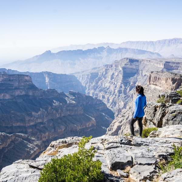 woman with shoulders covered in oman