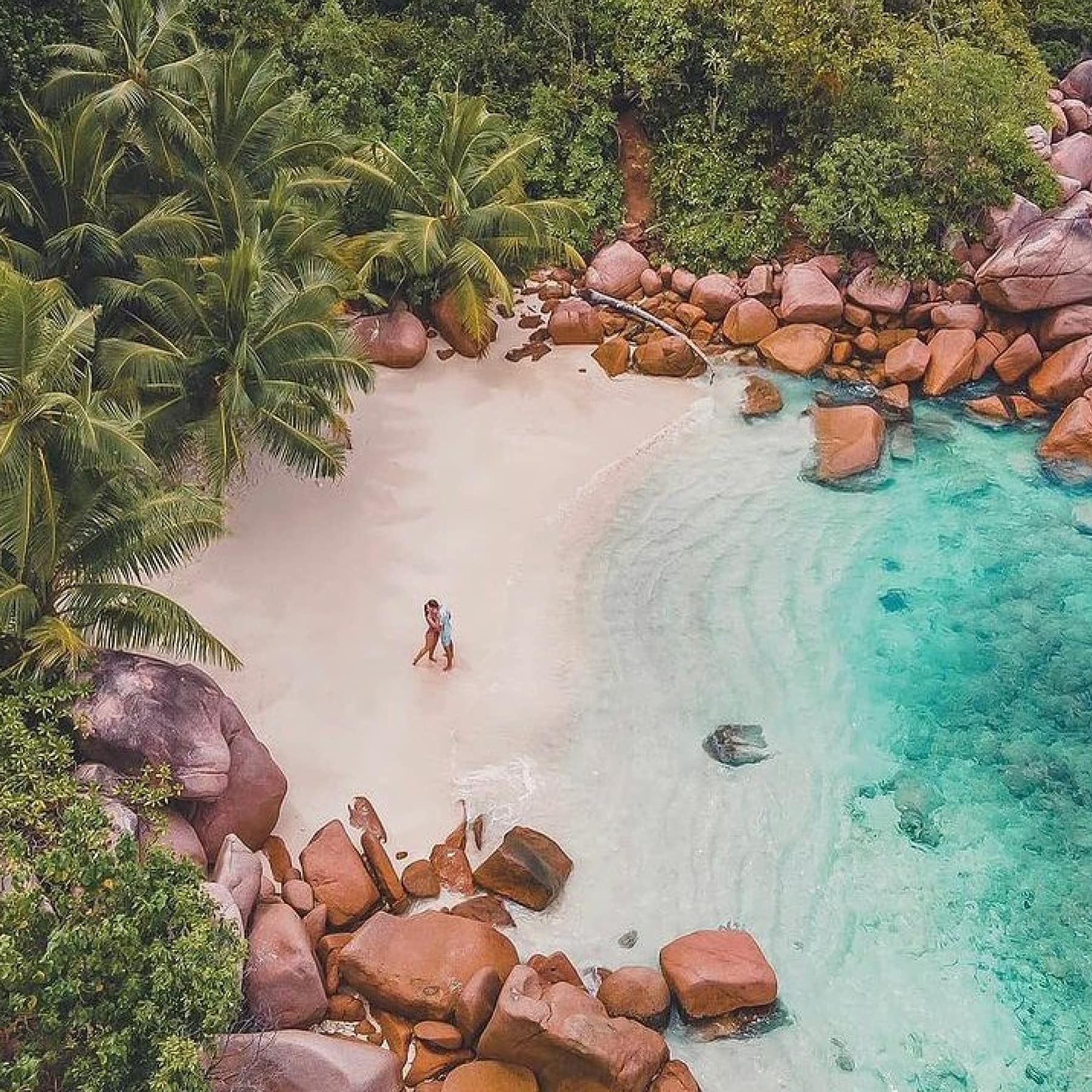 The beautiful Anse Lazio beach, surrounded by trees and rocks things to do in the Seychelles