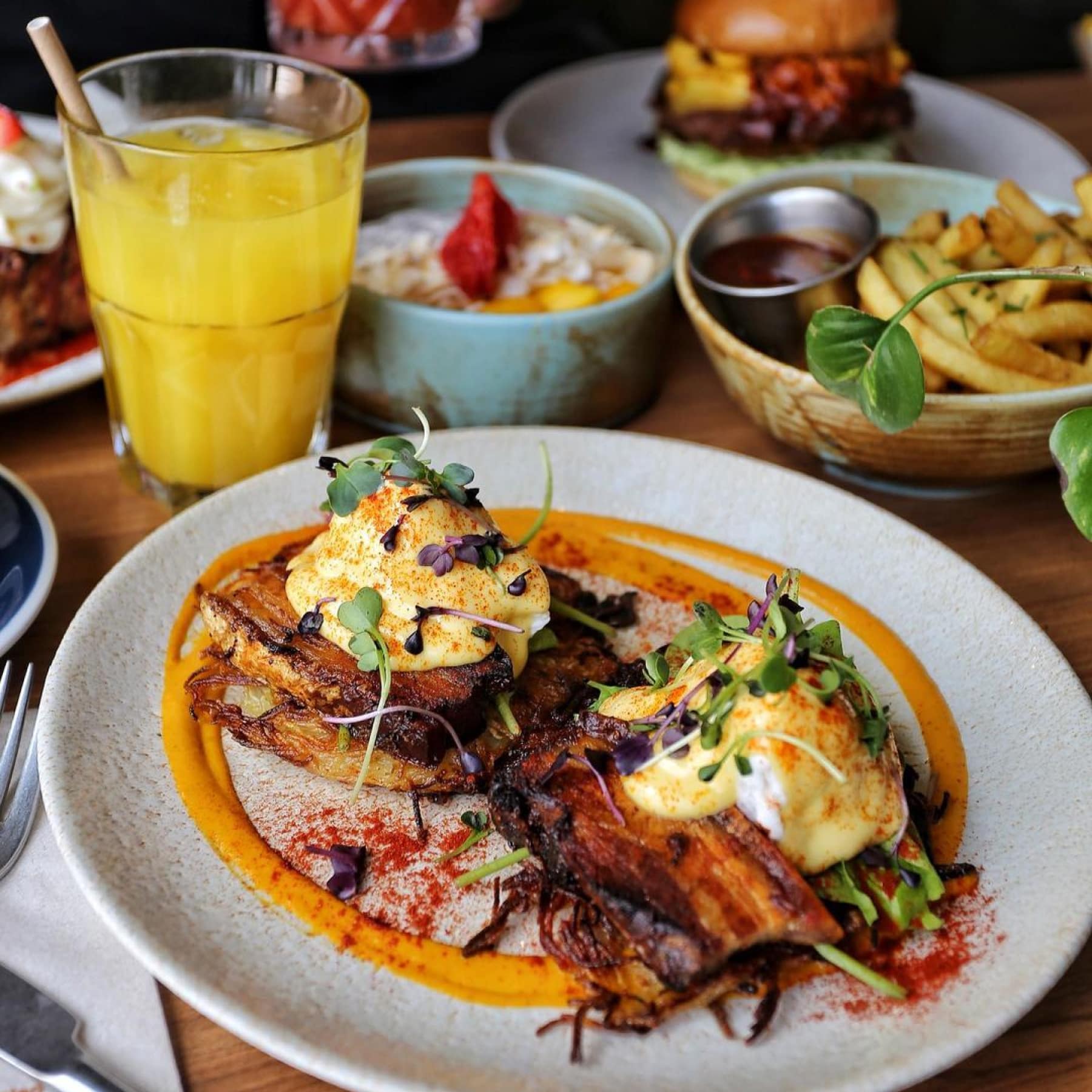 A tasty breakfast with orange juice on the side at The Greasy Spoon Cafe