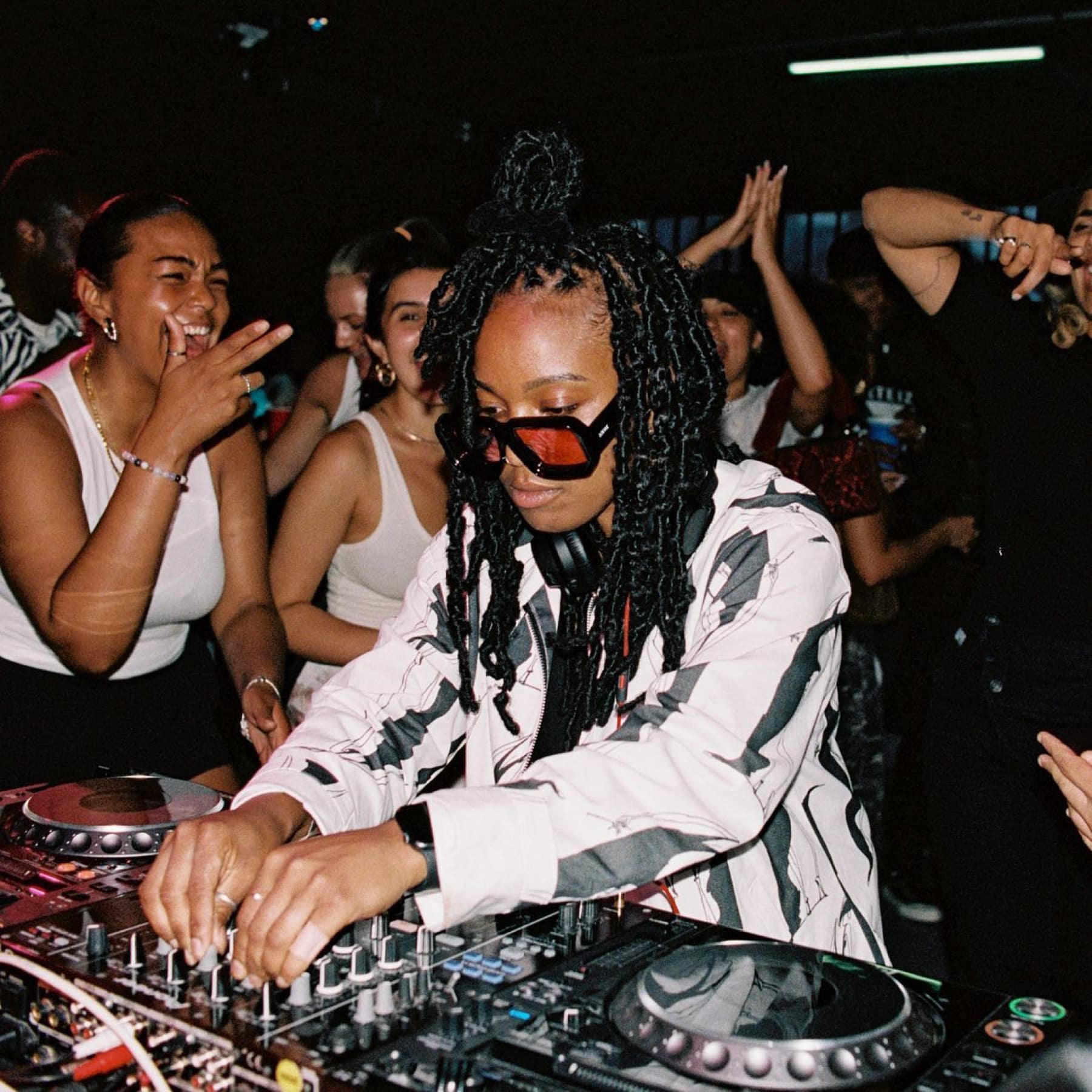 DJ surrounded by party goers in Stockholm