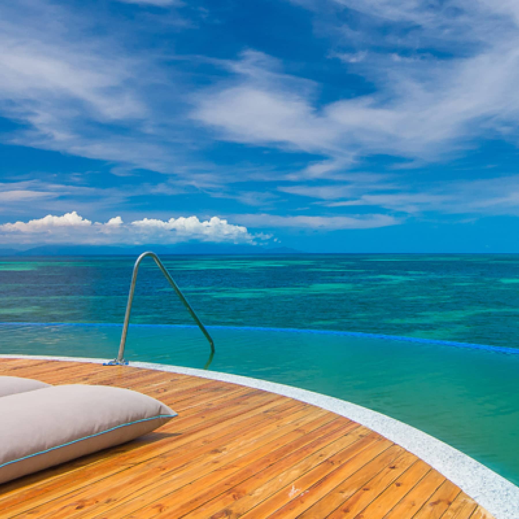 Pure sea views on pillowed decking on the sea at Coco de Mer Hotel & Black Parrot Suites
