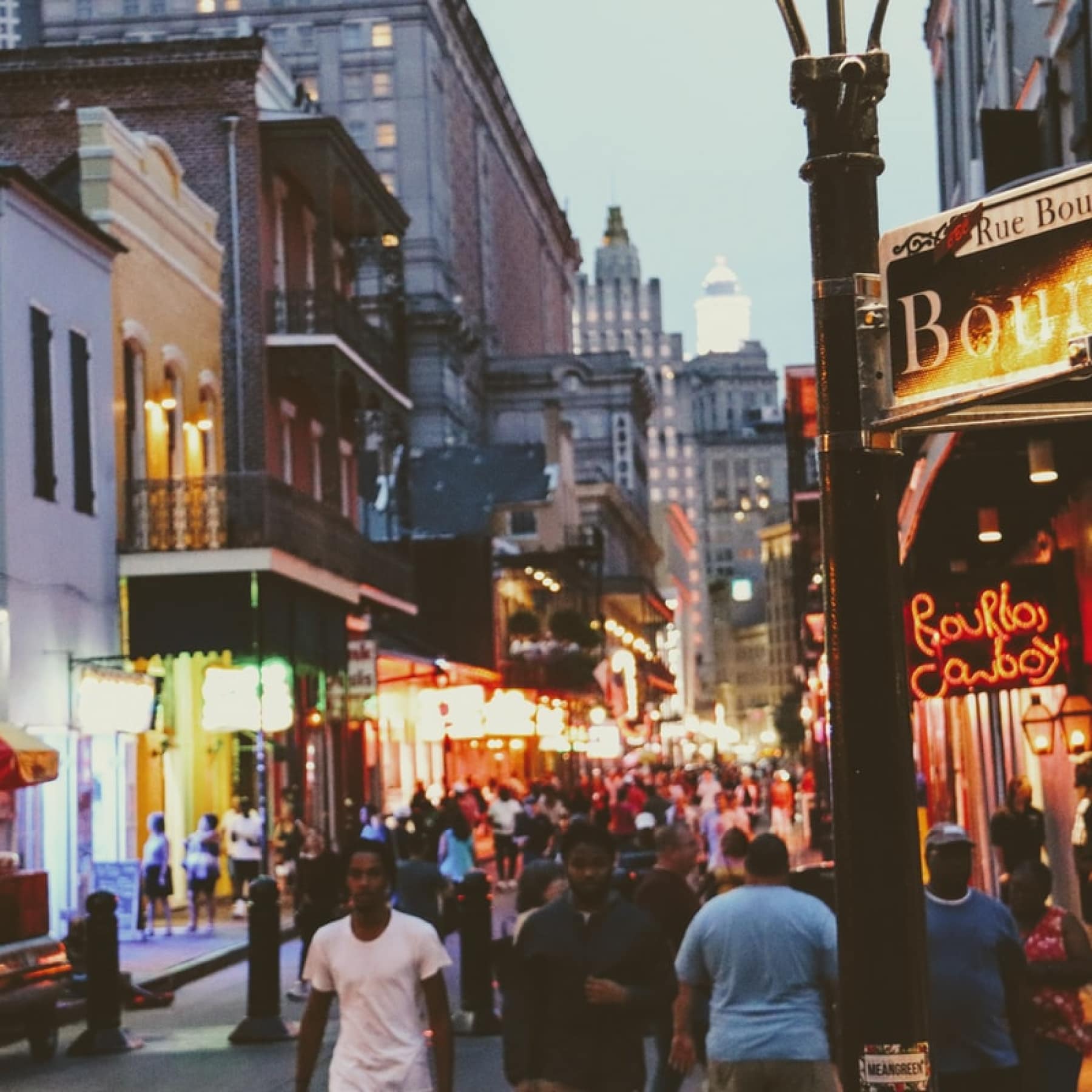 Colourful streets filled with people wandering New Orleans