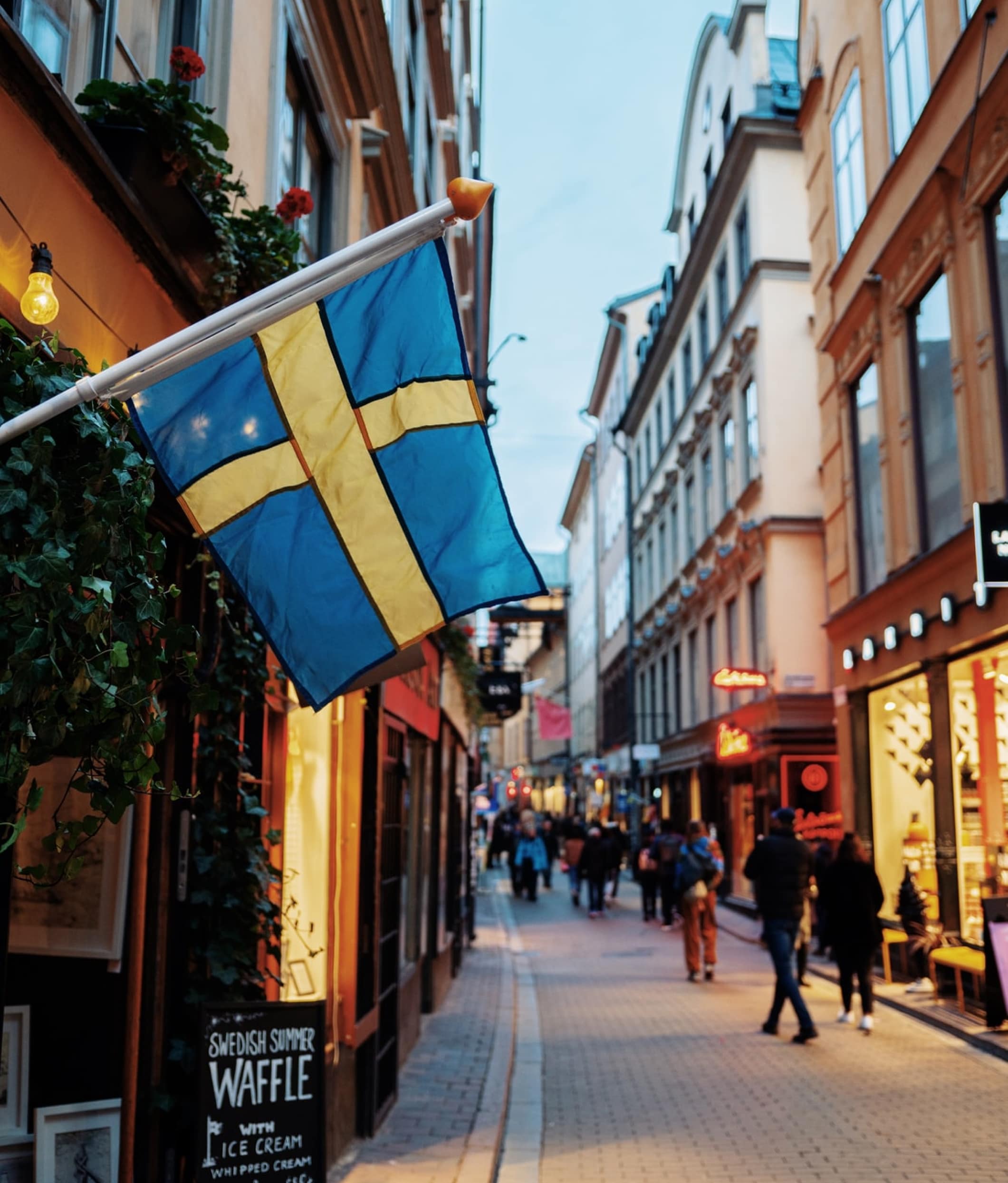 Swedish flag hanging down in the streets of Stockholm