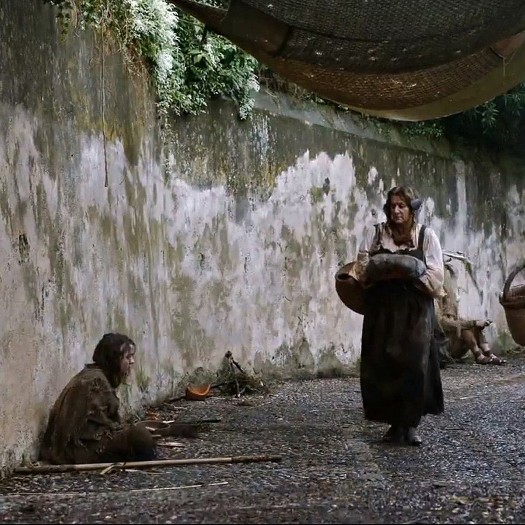Arya sits on the streets of Girona