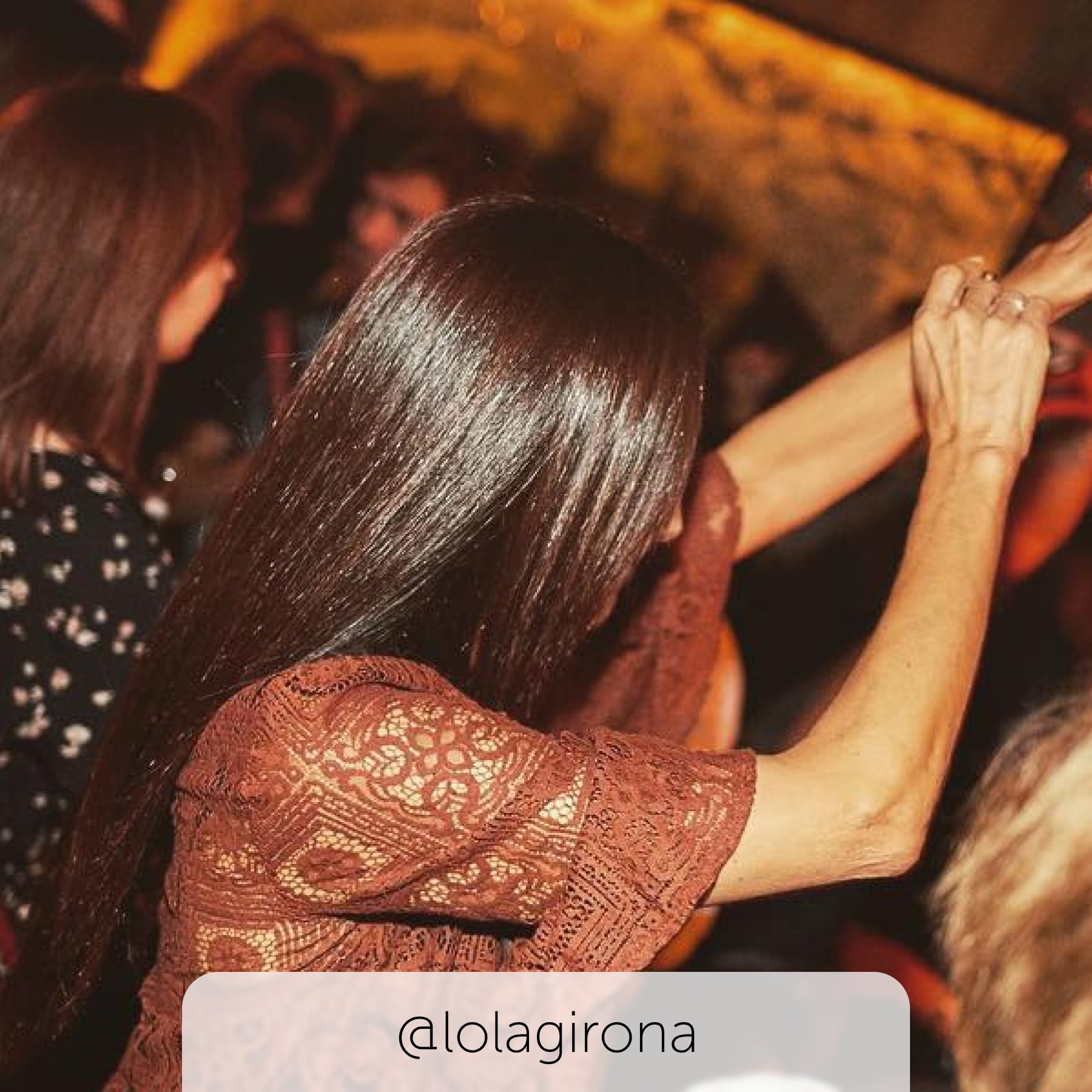 Lady dancing at Lola's