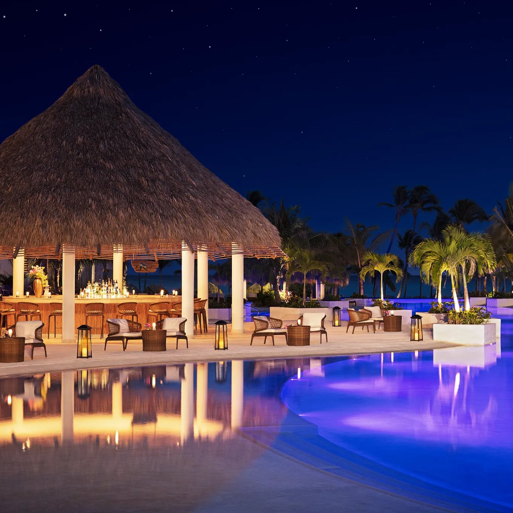 Secrets Cap Cana Resort at night, poolside