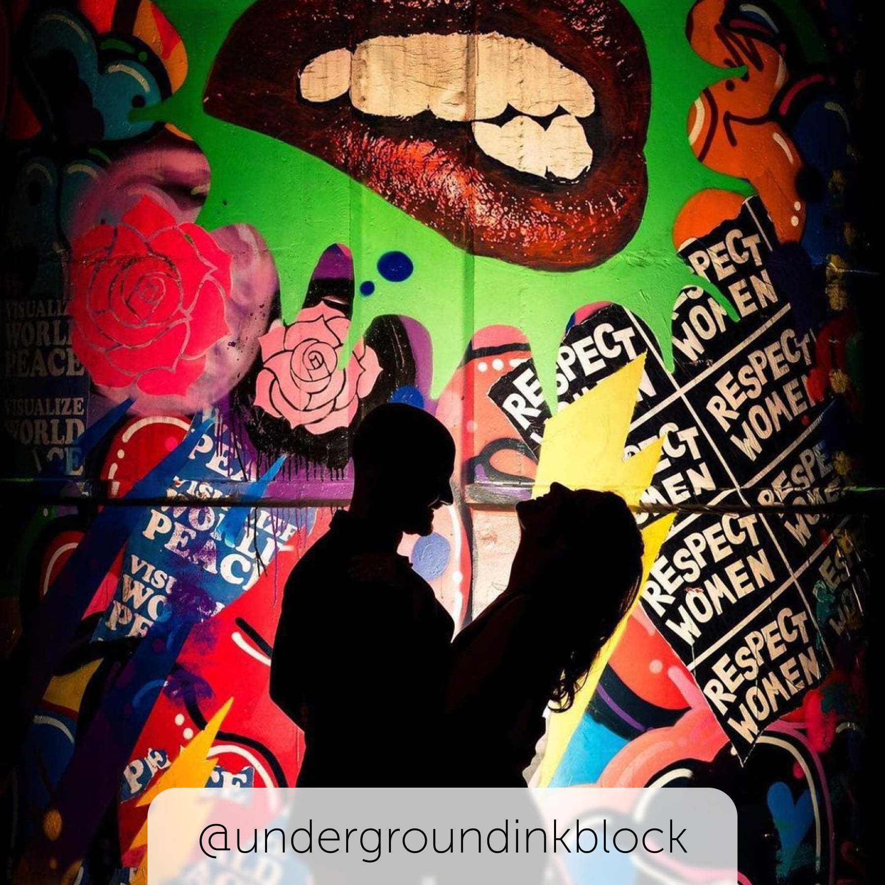 Underground at Ink Block silhouette of couple with graffiti background