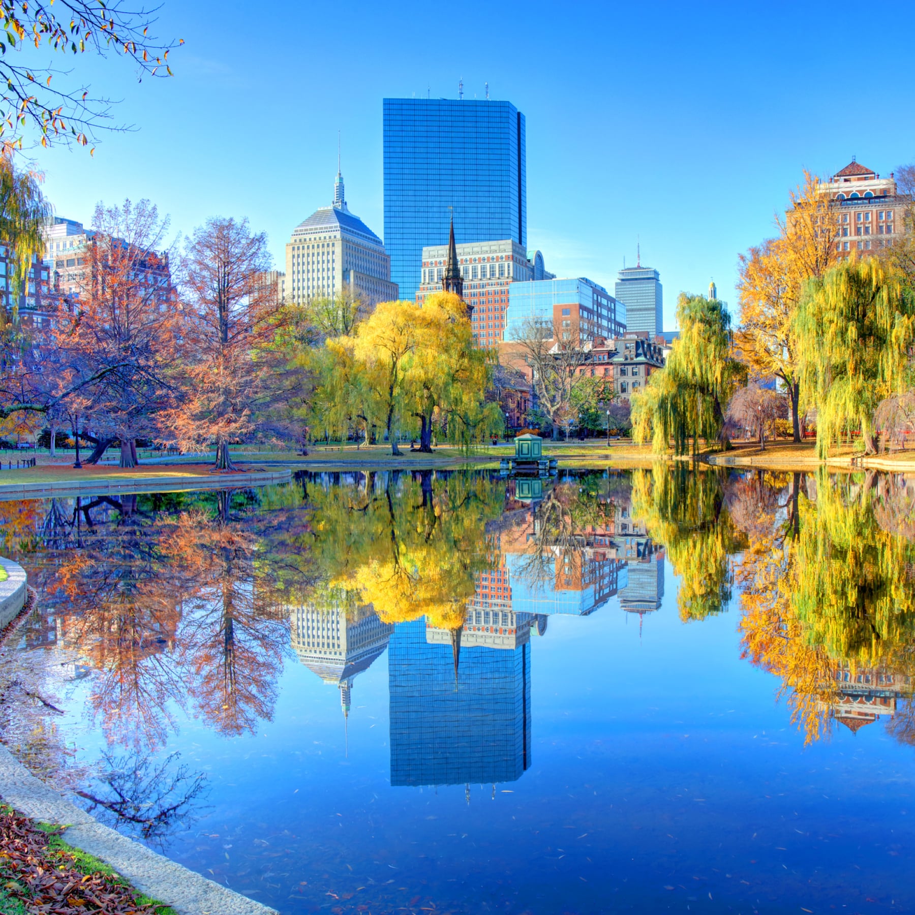 Skyline reflects in the water at Boston Common