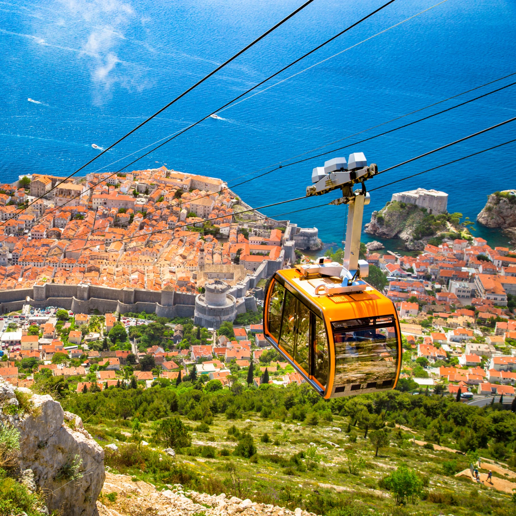 Zip line carrier takes people down the hillside of Dubrovnik